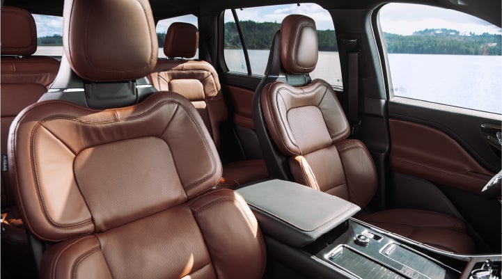 The front row's Perfect Position Seats in a 2023 Lincoln Aviator Reserve model with Ebony Roast interior