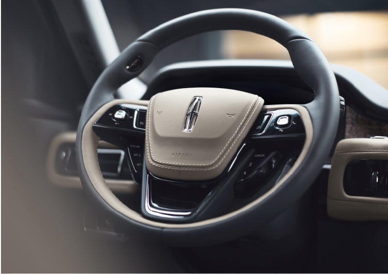 The intuitively placed controls of the steering wheel on a 2023 Lincoln Aviator® SUV | Holmes Tuttle Lincoln in Tucson AZ